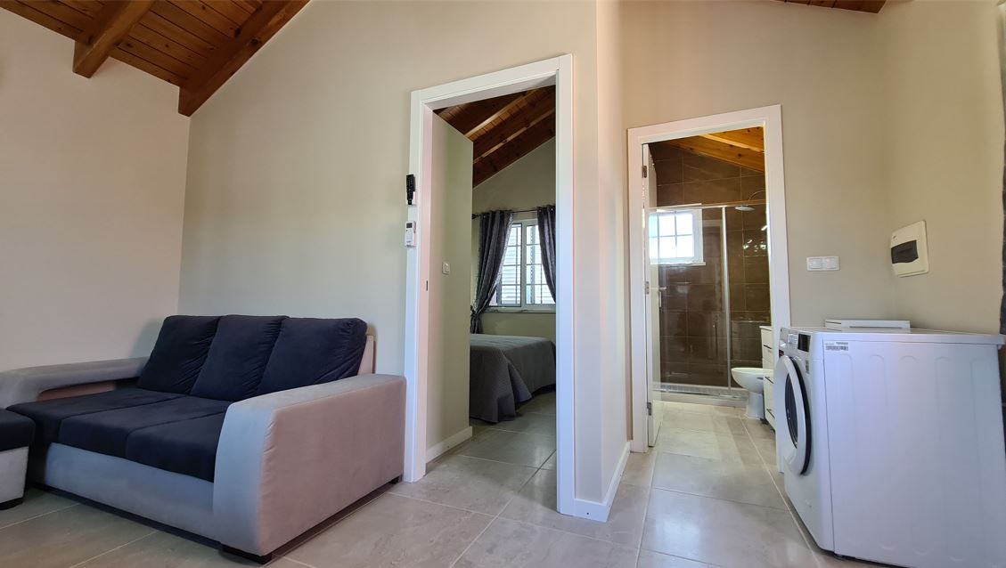 Villa da Silva Suite living area and washing machine